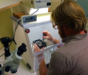 Data recovery technician Aaron Hook opens a hard drive in the 18" Portable Clean Room at $300 Data Recovery.