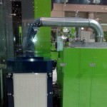 Sentry Air Systems Model 500 portable fume extractor attached to Engel Machinery injection molding equipment.