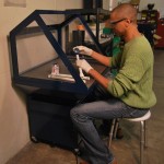 Sentry Air's Portable Downdraft Bench with hood of clear plexi walls.